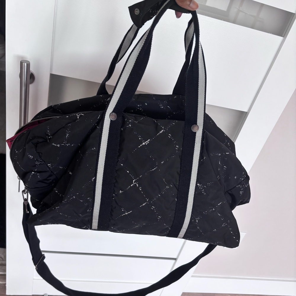 Sold consigned. Chanel sports line travel duffle bag tote. Good condition.